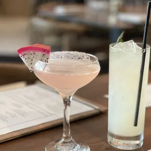 two cocktails sitting on a table