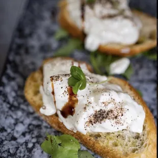 two pieces of bread topped with whipped cream