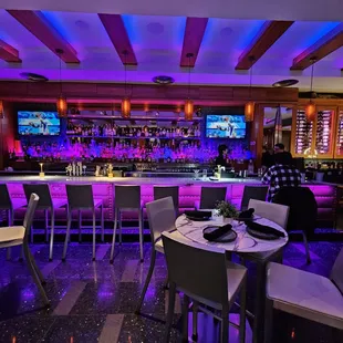 a bar with purple lighting