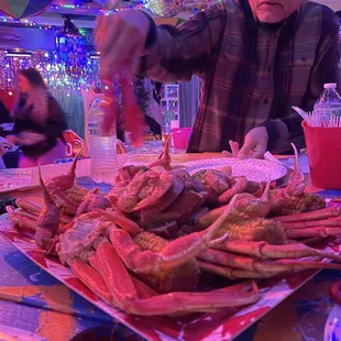 a man preparing crab legs