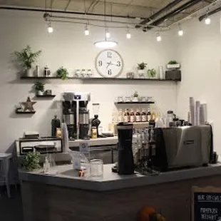 a coffee shop with a clock on the wall