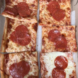 four slices of pepperoni pizza