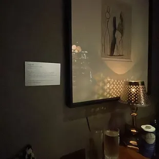 a dark room with a table and chairs