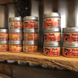 a variety of tins on a shelf