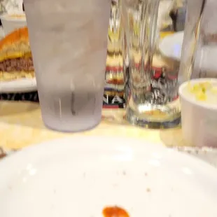 Water glass next to both beer glasses.