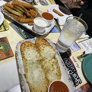 Garlic bread, fried zucchini, mozzarella sticks