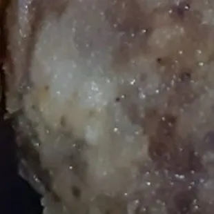 a hamburger with a bite taken out of it