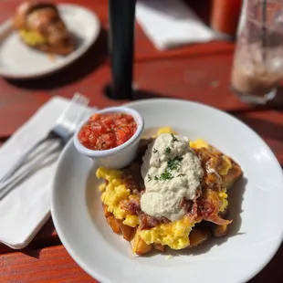 The Country Burrito, "bowl style". Scrambled eggs bacon roasted potatoes salsa cheddar jack cheese and green chili sour cream