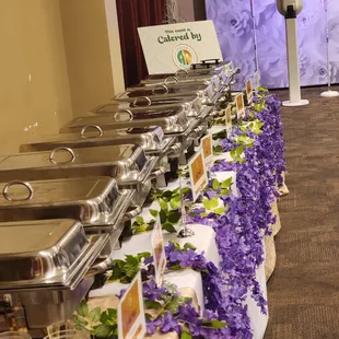 a buffet table with a variety of food items