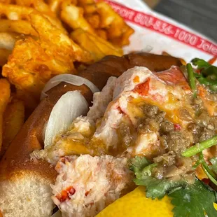 Buttah Lobster roll sandwich and waffle fries