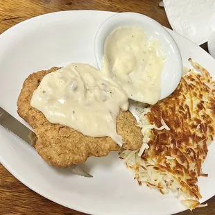 Chicken Fried Steak with gravy and hash browns