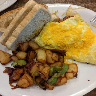 Polish Sausage Omelette with homestyle potatoes and sour dough toast. A little salty but was good, will add a vegetable to it next time.