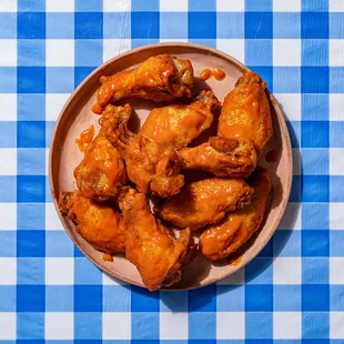 a plate of chicken wings