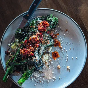 Charred broccolini. Creamed green garlic, lardon, parmesan, chili crunch, bread crumbs.