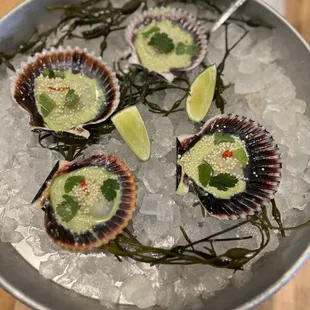 Hokkaido scallops with coconut vinaigrette masago, pickled Thai chili, and scallions