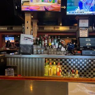 a bar with a television in the background