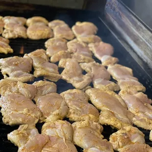 chicken cooking on a grill