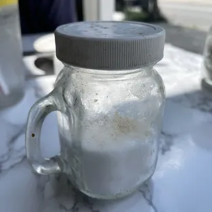 The salt and pepper shakers are filthy.  Please wash them,  They are sticky to the touch.  Yuck!