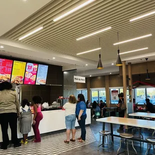 a group of people at a fast food restaurant