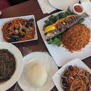 Lamb bowl, something fishy (that's the name of the grilled branzino dish), suya beef, efo riro with fufu