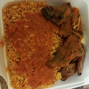 Jallof rice, plantain and fried goat meat!