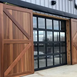 Full view glass door with cedar slider on a pool house