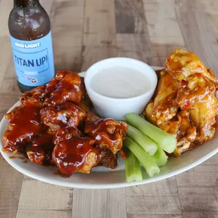 The best wings in town are at Jollie Ollie&apos;s Pizza and Pub. Wing platter served up with locally brewed beer. Titan Up!