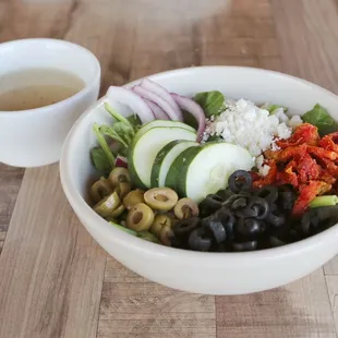 Vibrant and tasty Greek salad filled to the rim for a refreshing meal all it&apos;s own.