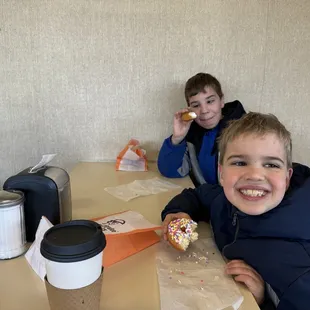 Rodger and Sylvester with daddy on a donut  day!