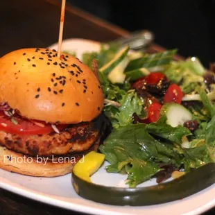 Salmon Burger ($17) - sesame cilantro slaw, tomato, sriracha aioli, toasted sriracha bun