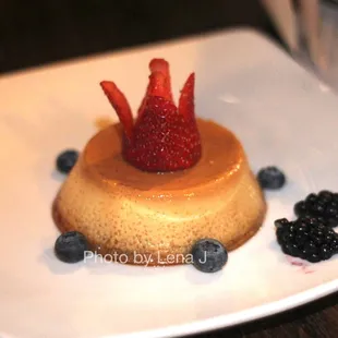Caramel Creme Flan ($9) - caramel sauce, fresh berries
