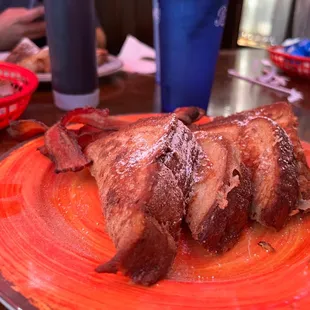 a plate of bacon on a table