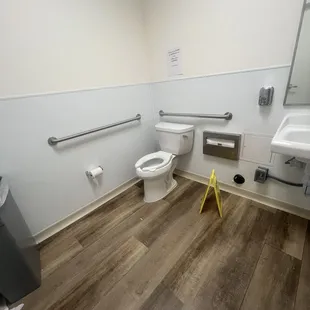 Water around the toilet, could be urine.
