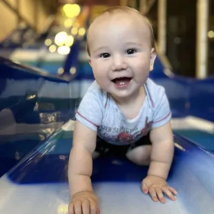 Waiting for brother at the bottom of the slides