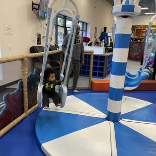 In the 4 and under section where you can push to swing (no seatbelts) but you can have it go slow
