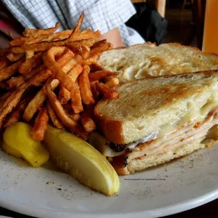 Hot turkey + Swiss with fresh-cut seasoned fries.