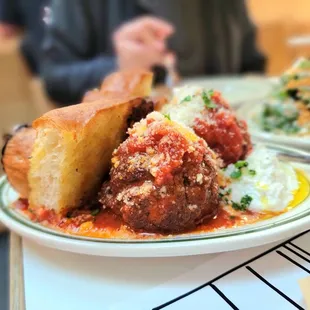 MARINARA BRAISED MEATBALLS, RICOTTA, GARLIC BREAD ($19.75)