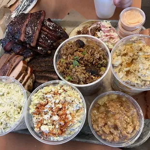 Turkey, white brisket, pork taco, brisket fried rice, Mexican street corn, coleslaw, fruit crunch, burger tater tot casserole!