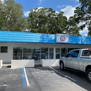 a truck parked in front of a building