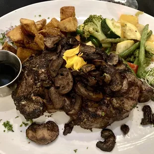 Ribeye steak, mushrooms, summer vegetables, roasted potatoes