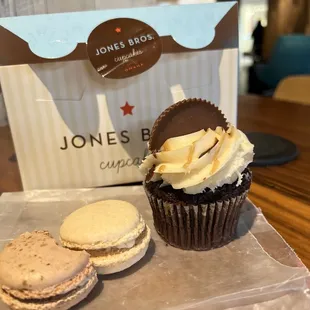 a chocolate cupcake and two cookies