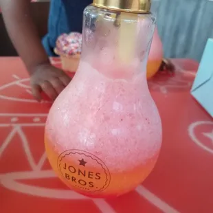 a girl sitting at a table