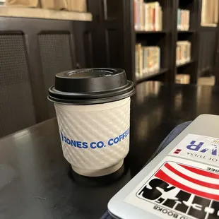 My coffee against the backdrop of the McFarlin library.