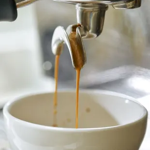 coffee being poured into a cup