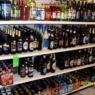 shelves full of various types of beer