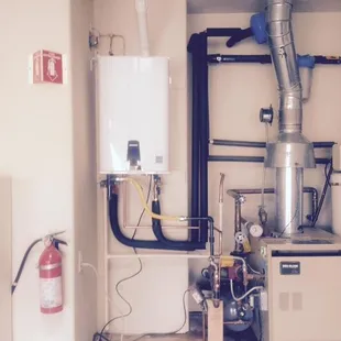 Removal of existing 75 gallon water heater replaced with new Navien Npe-A model