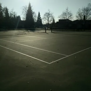 2 tennis courts. One of the court is slanted.
