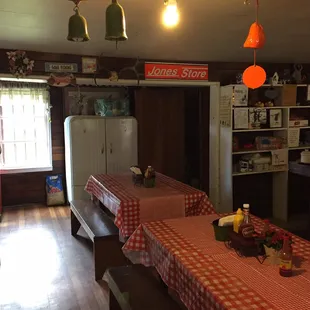 a long table with red and white checkered tablecloths