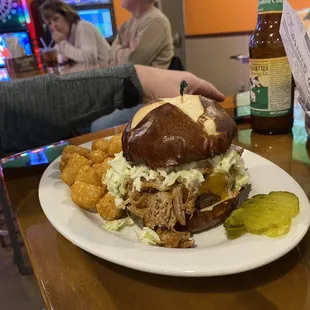 Burger with Pulled pork on Pretzel Bun! Delish