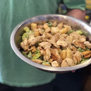 a bowl of chicken and broccoli